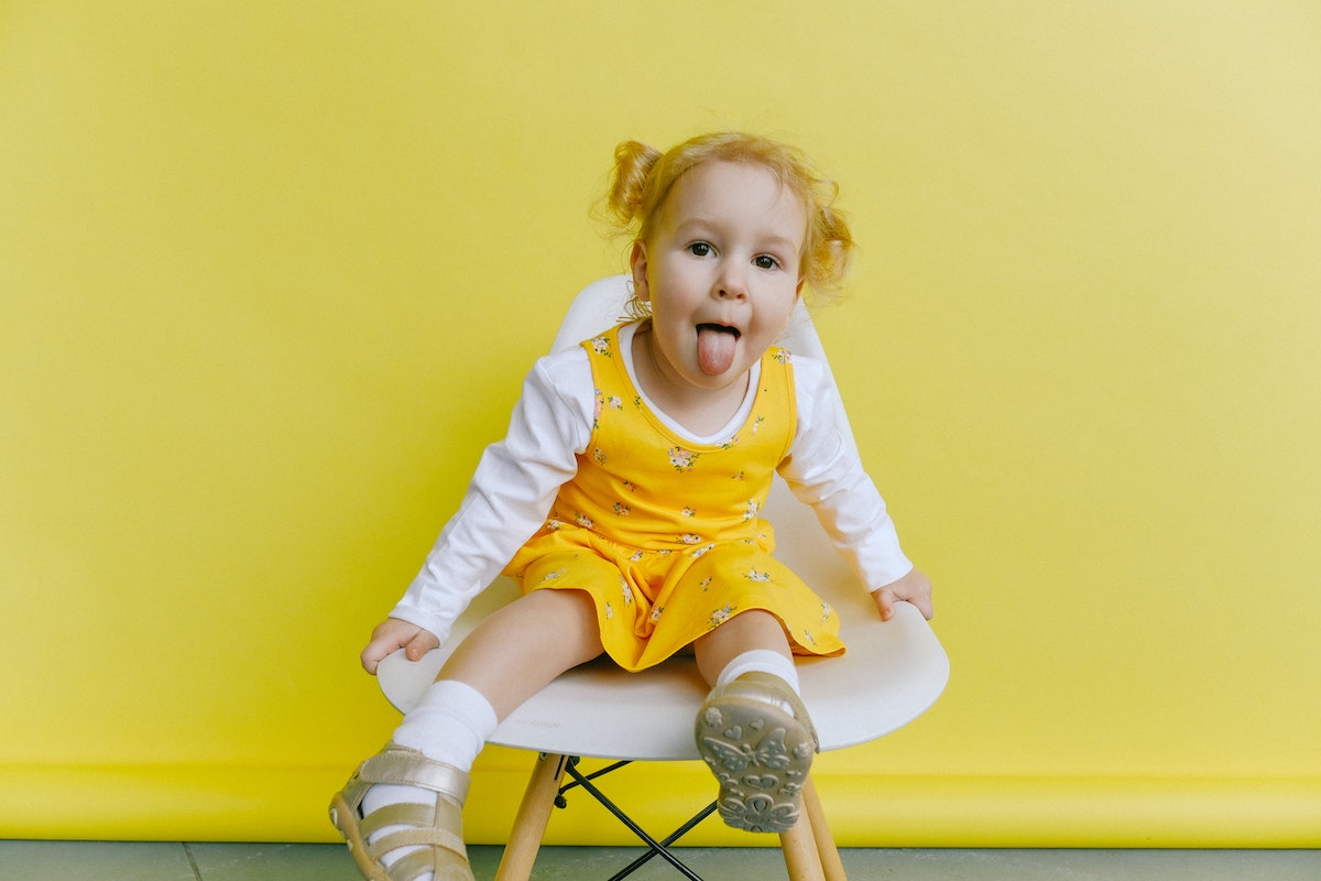 Small toddler sticking her tongue out in playful manner
